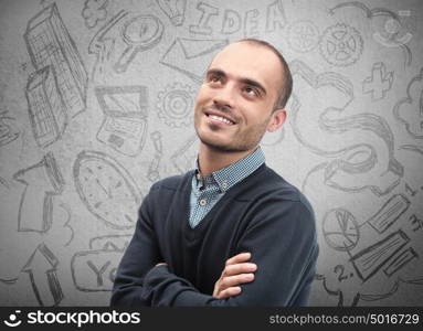 Young business man thinking of his plans closeup face portrait and sketches overhead