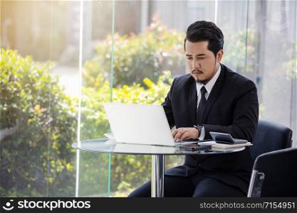 young business man using laptop computer