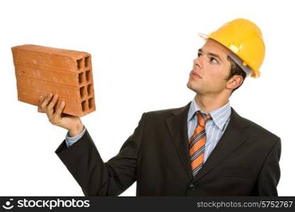young business man with a brick, on white
