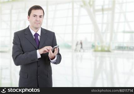 young business man with a phone at the office