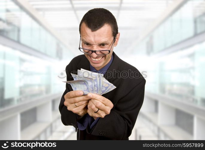 young business man with money at the office