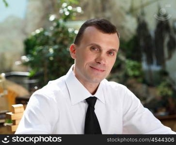 young business man working with documents in garden