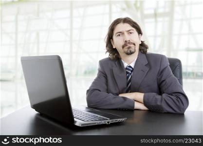 young business man working with is laptop, at the office