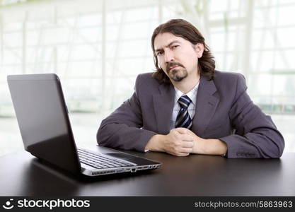 young business man working with is laptop at the office