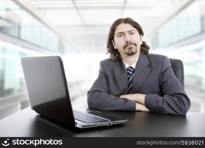 young business man working with is laptop at the office