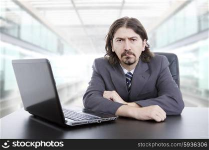 young business man working with is laptop at the office