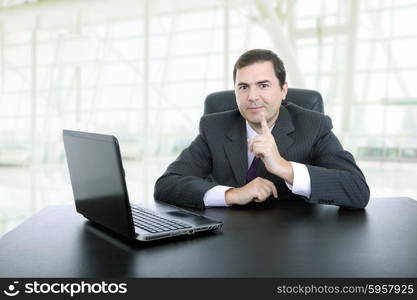 young business man working with is laptop at the office