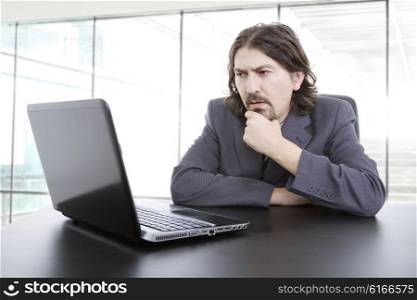 young business man working with is laptop at the office