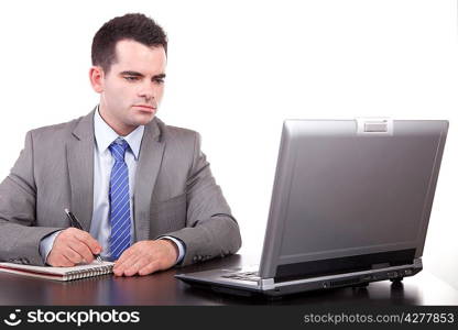 Young business man working with laptop, isolated