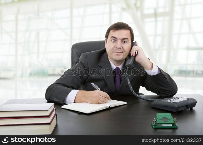young business man writing on a desk