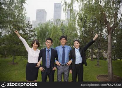 Young business people in the park, portrait