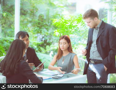 young business people making meeting and talking for analyzing marketing working at office on desk.