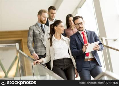Young business people on stairs