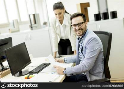 Young business people sitting in the office and working