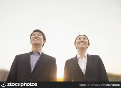 Young business people smiling