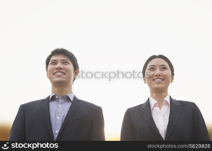Young business people smiling