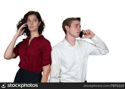Young business people talking on cell phones
