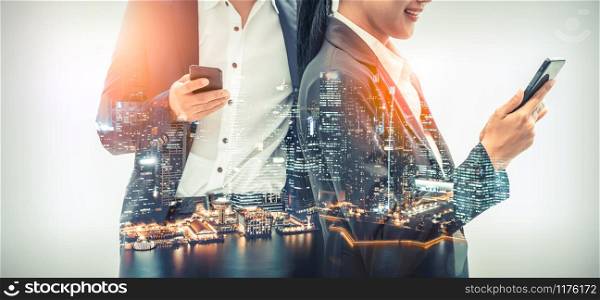 Young business people using mobile phone with modern city buildings background. Future telecommunication technology and internet of things ( IOT ) concept.. Mobile phone telecommunication technology concept