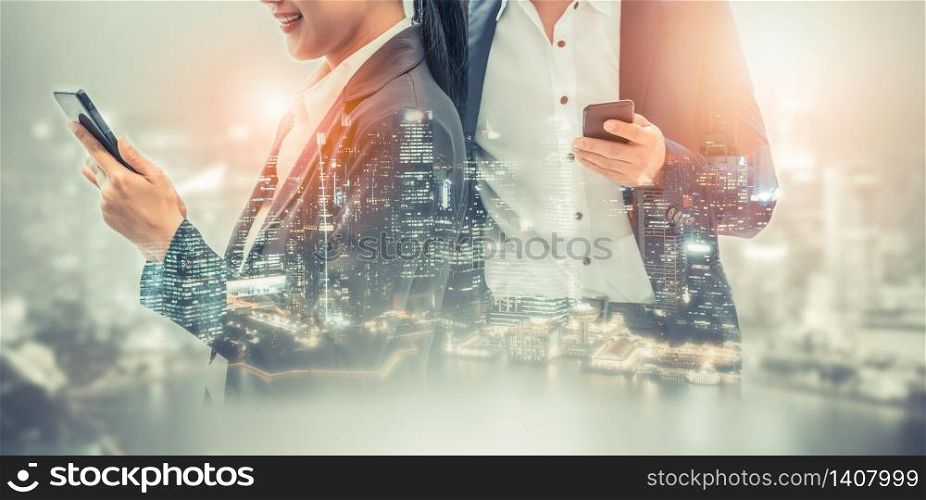 Young business people using mobile phone with modern city buildings background. Future telecommunication technology and internet of things ( IOT ) concept.. Mobile phone telecommunication technology concept