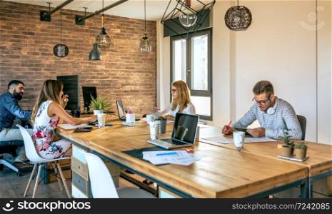 Young business people working in a coworking office. Business people working in a coworking office
