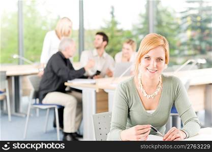 Young business students having meeting - businesswoman in front