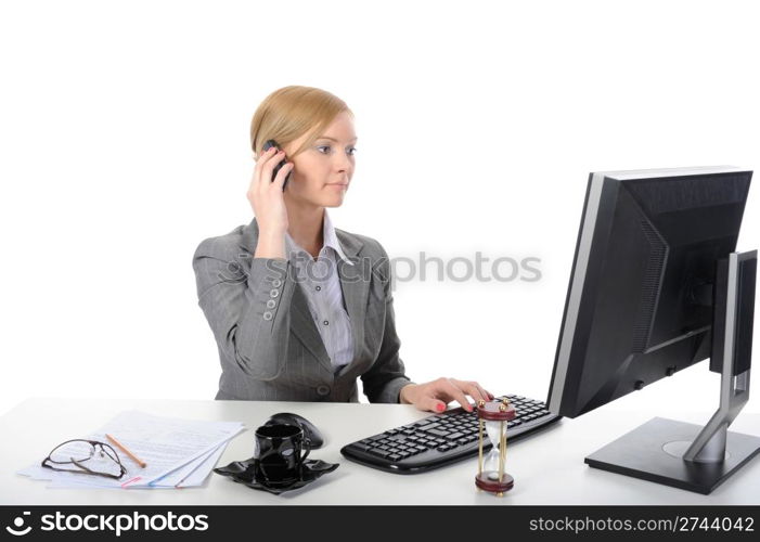 Young business woman at work in the office. Isolated on white background