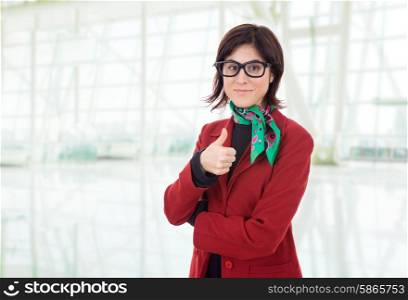 young business woman going thumb up, at the office