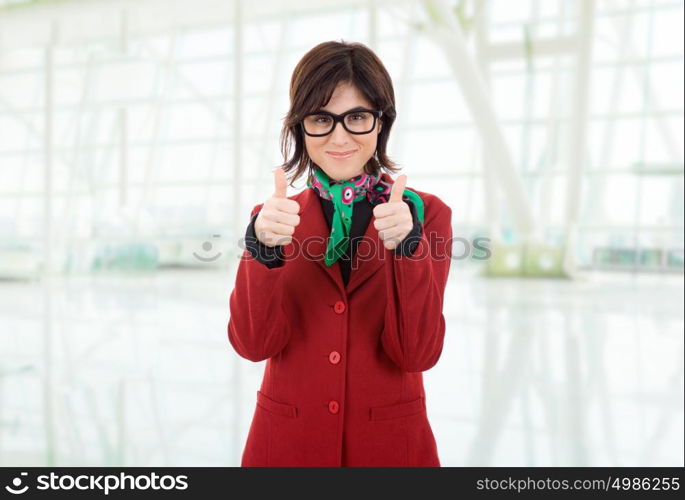 young business woman going thumbs up, at the office