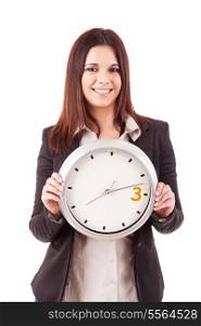 Young business woman holding a white clock, isolated over white background