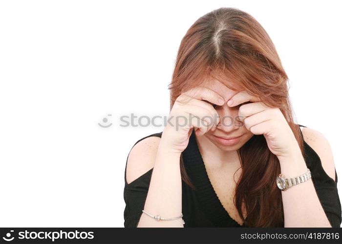 Young business woman looking worried at desk on white background
