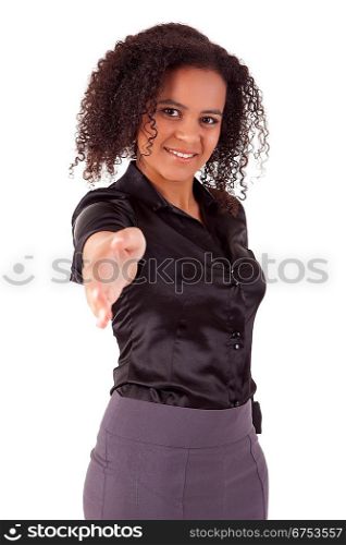 Young business woman offering handshake - selective focus on face