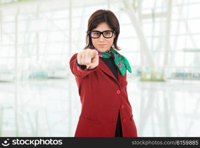 young business woman pointing at the office