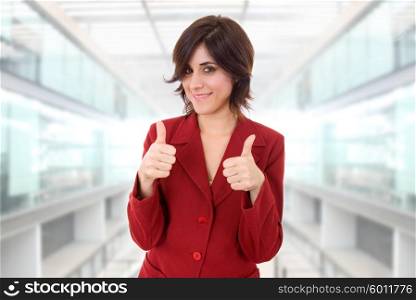 young business woman portrait going thumbs up, at the office