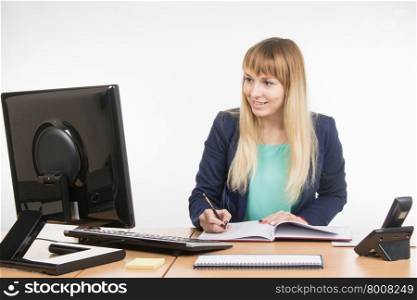 Young business woman secretary sitting at office desk working, isolated on white background