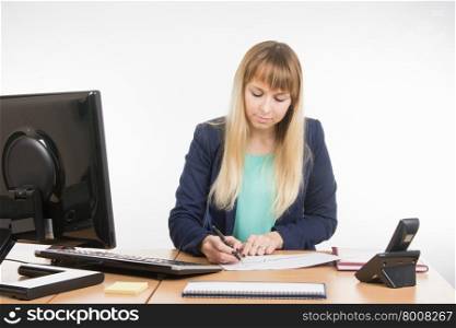 Young business woman secretary sitting at office desk working, isolated on white background