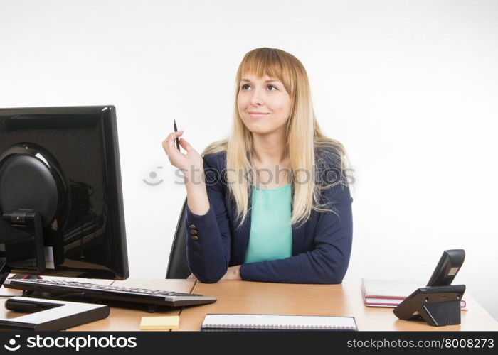 Young business woman secretary sitting at office desk working, isolated on white background