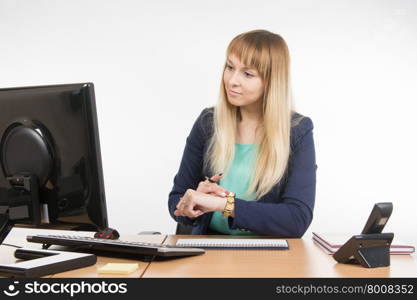 Young business woman secretary sitting at office desk working, isolated on white background