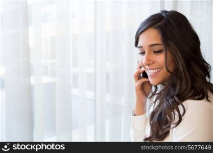 Young business woman talking on the phone