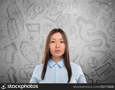 Young business woman thinking of her plans closeup face portrait and sketches overhead