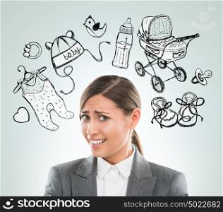 Young business woman thinking of her pregnancy plans closeup face portrait and sketches overhead