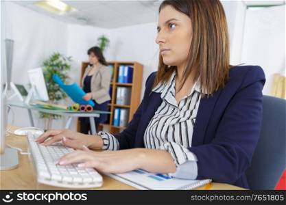 young business woman with computer in the office