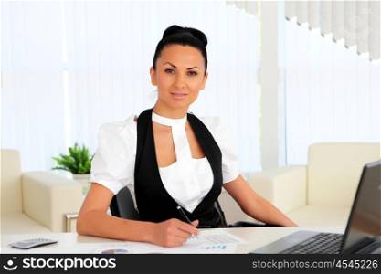 young business woman with papers in the office