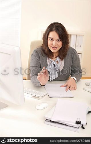 Young business woman working at modern office with computer