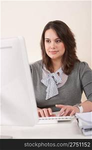 Young business woman working at modern office with computer
