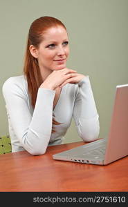Young business woman working at office with laptop