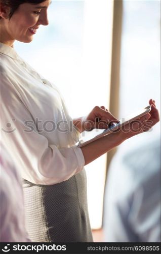 young business woman working on tablet computer at office