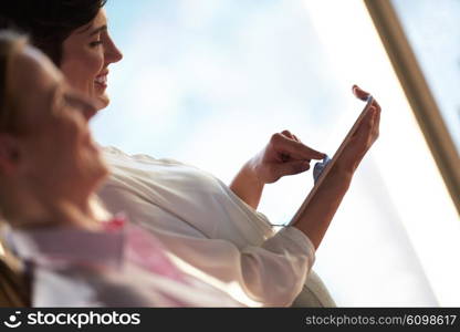 young business woman working on tablet computer at office