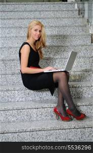 young business woman working wireless on laptop