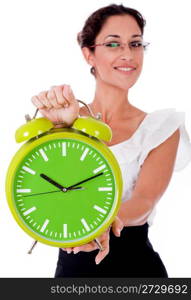 Young business womanshowing a green color clock on isolated white background