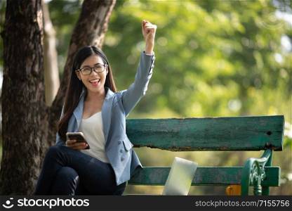 Young business women are enjoying outdoor office work, business success concept